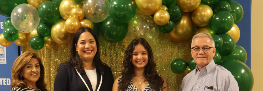 ambassador high school girl scout wearing sash outside against green background
