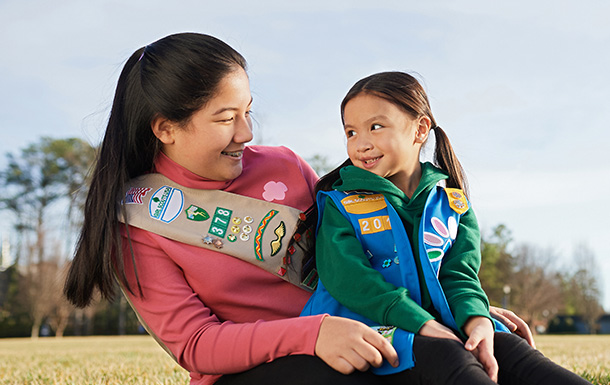 high school girl scout with daisy outside wearing uniforms